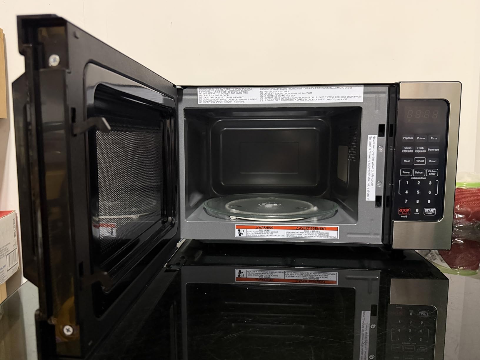 Farberware 0.7 Cu. Ft. Countertop Microwave Oven - 700 Watts Power, Auto Cook Settings, Defrost, Easy Clean and Child Safety Lock - Stainless customer photo 1