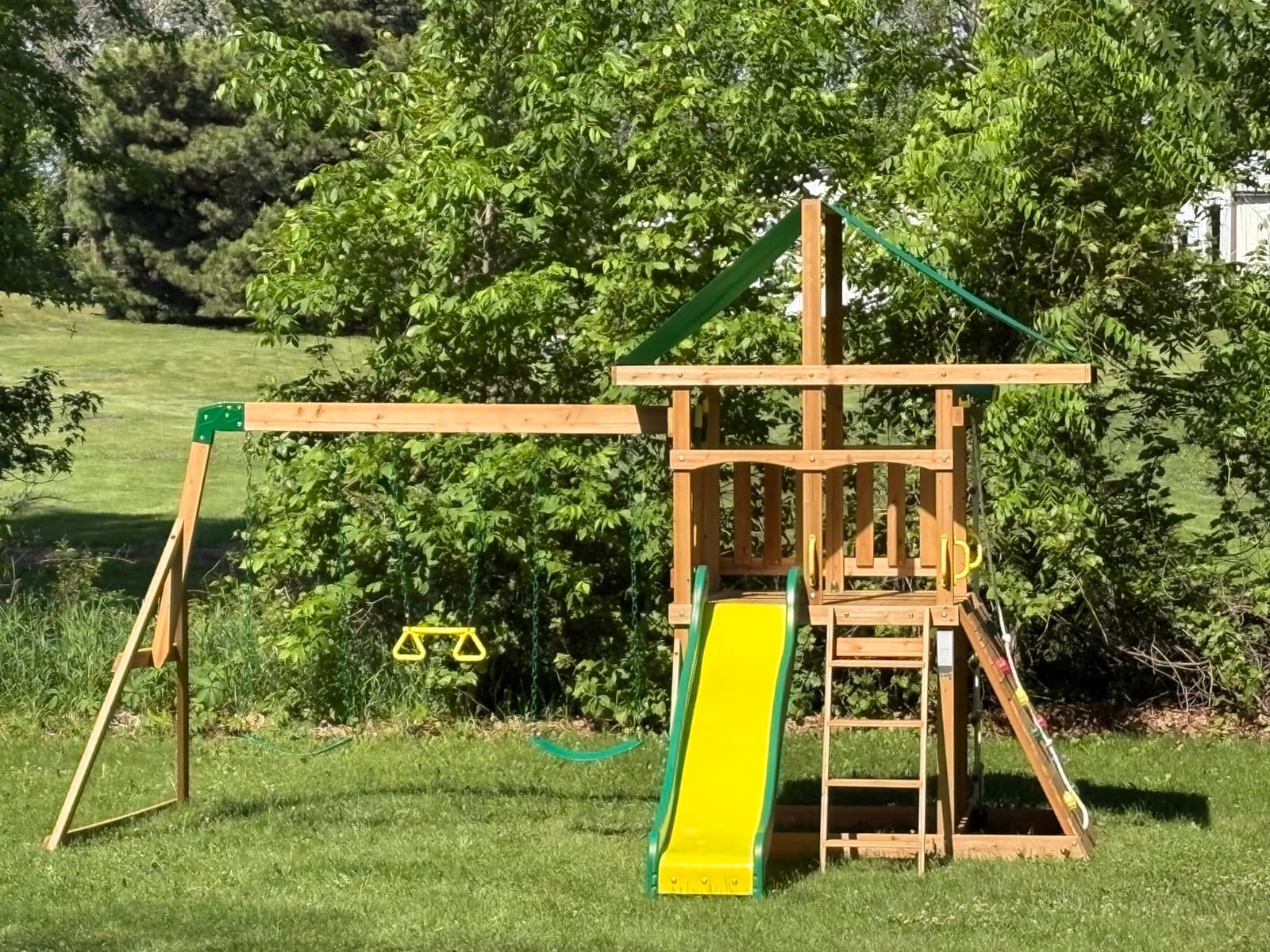 Backyard Discovery Mount Mckinley Cedar Wood Swing Set with Wave Slide, Play Deck, Double Rock Wall, Rope Ladder, Web Swing, Belt Swings, Toy Telescope, Steering Wheel, Sandbox Area, Outdoor Playset customer photo 2