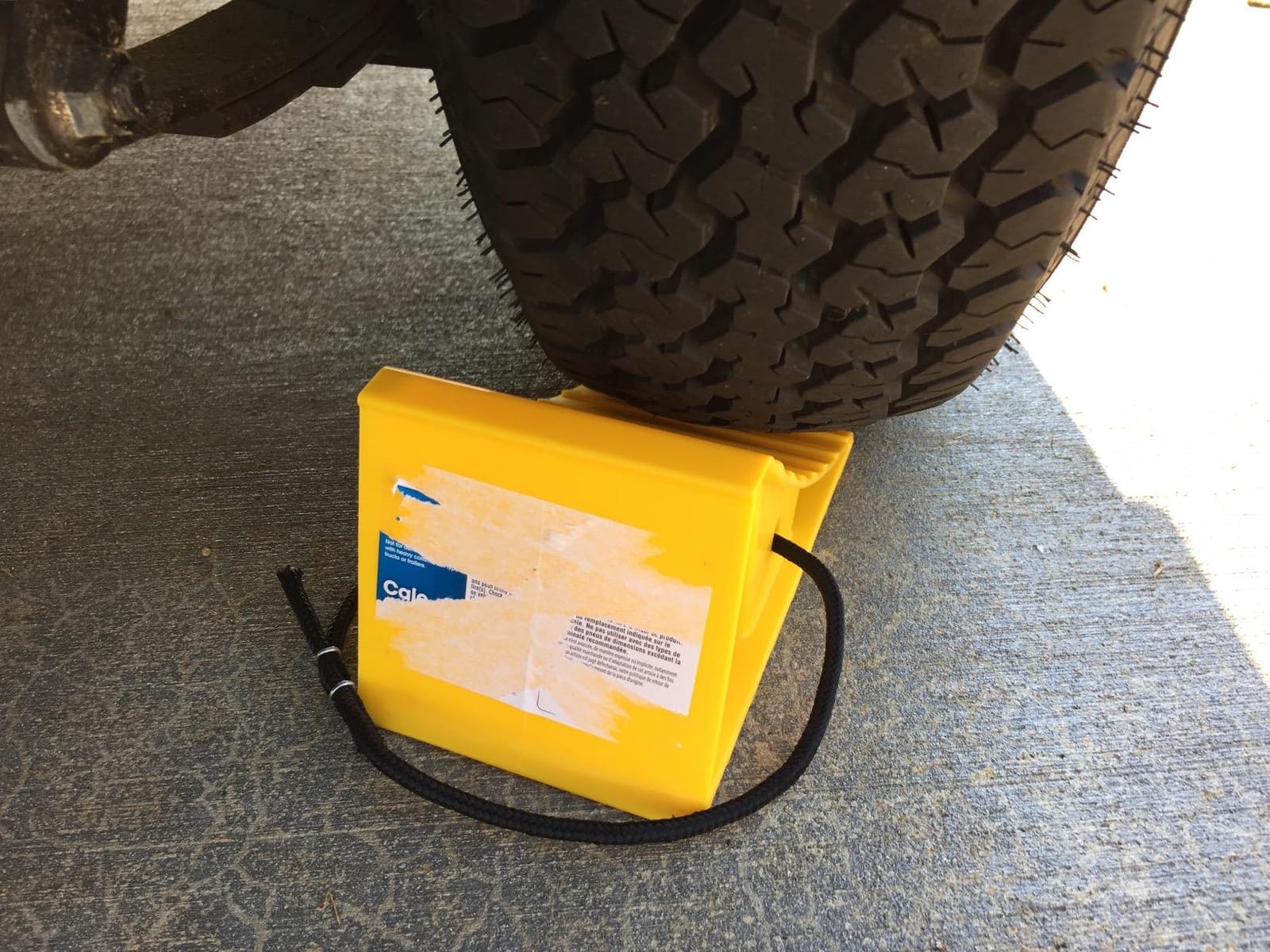 Camco RV Wheel Chocks with Rope - 2-Pack - Made in the USA | Keeps Trailer in-Place to Safely Unhitch - Compatible w/ Wheels Up to 26