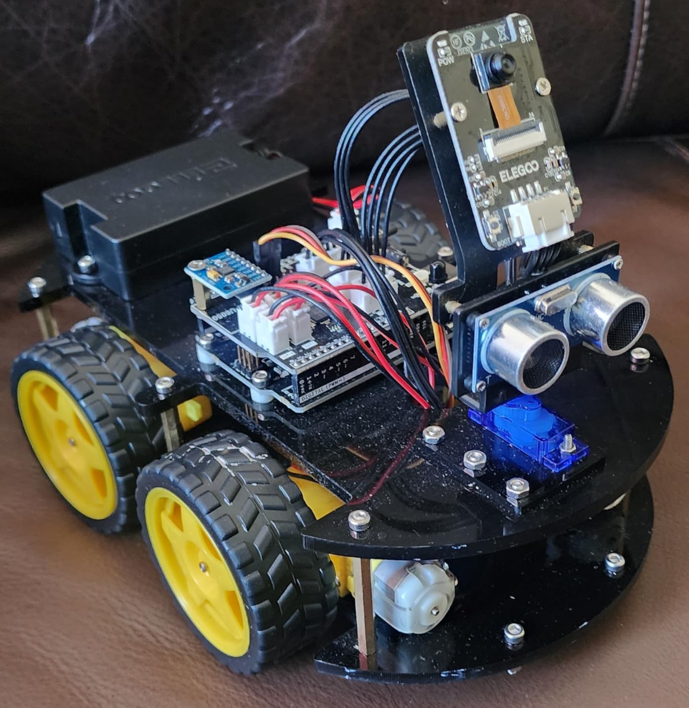 ELEGOO UNO R3 Smart Robot Car Kit V4 with Camera, Compatible with Arduino | FPV Video, Line Tracking, Obstacle Avoidance, Auto Follow, App & IR Control, Class STEM Building & Coding Kit, Gift for 12+ customer photo 1
