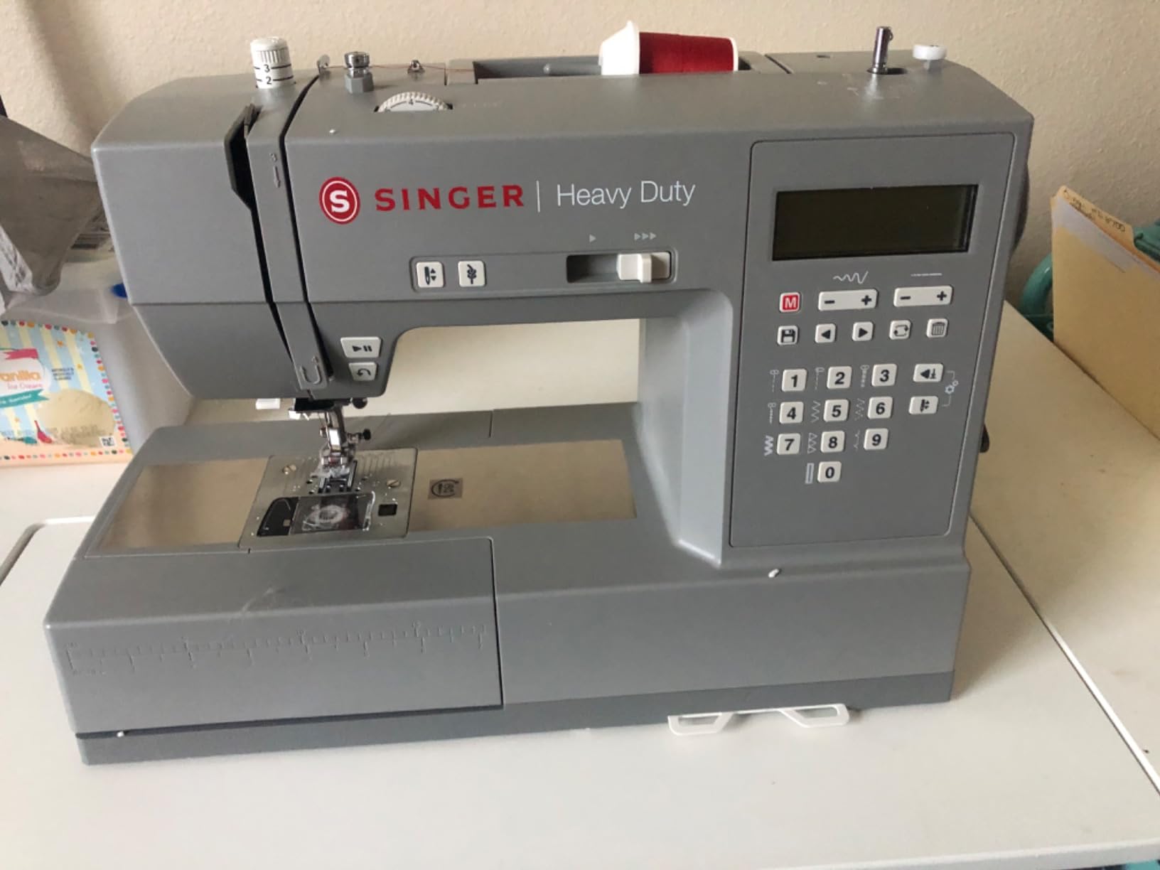 SINGER 6700C Heavy Duty Computerized Machine with Accessory Kit | 411 stitch applications, lettering, touch button stitch selection, 1100 stitches/min, 1-step buttonhole, LCD screen, LED light customer photo 2