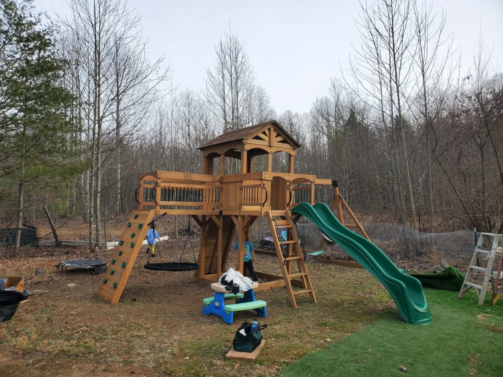 Backyard Discovery Sterling Point Cedar Wood Swing Set with Wave Slide, Raised Clubhouse, Wooden Bridge, Rock Wall, Belt Swings, Web Swing, Trapeze, Balcony, Climbing Wall, Ladder, Outdoor Playset customer photo 1